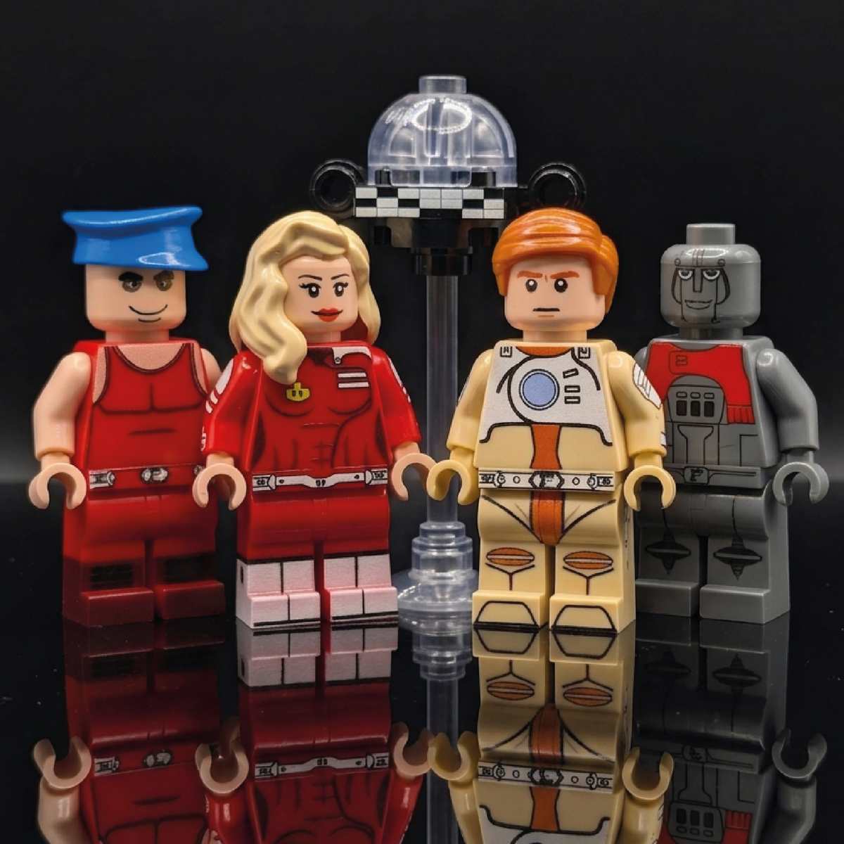 Four custom sci-fi movie collectible minifigures standing in a row against a dark background.